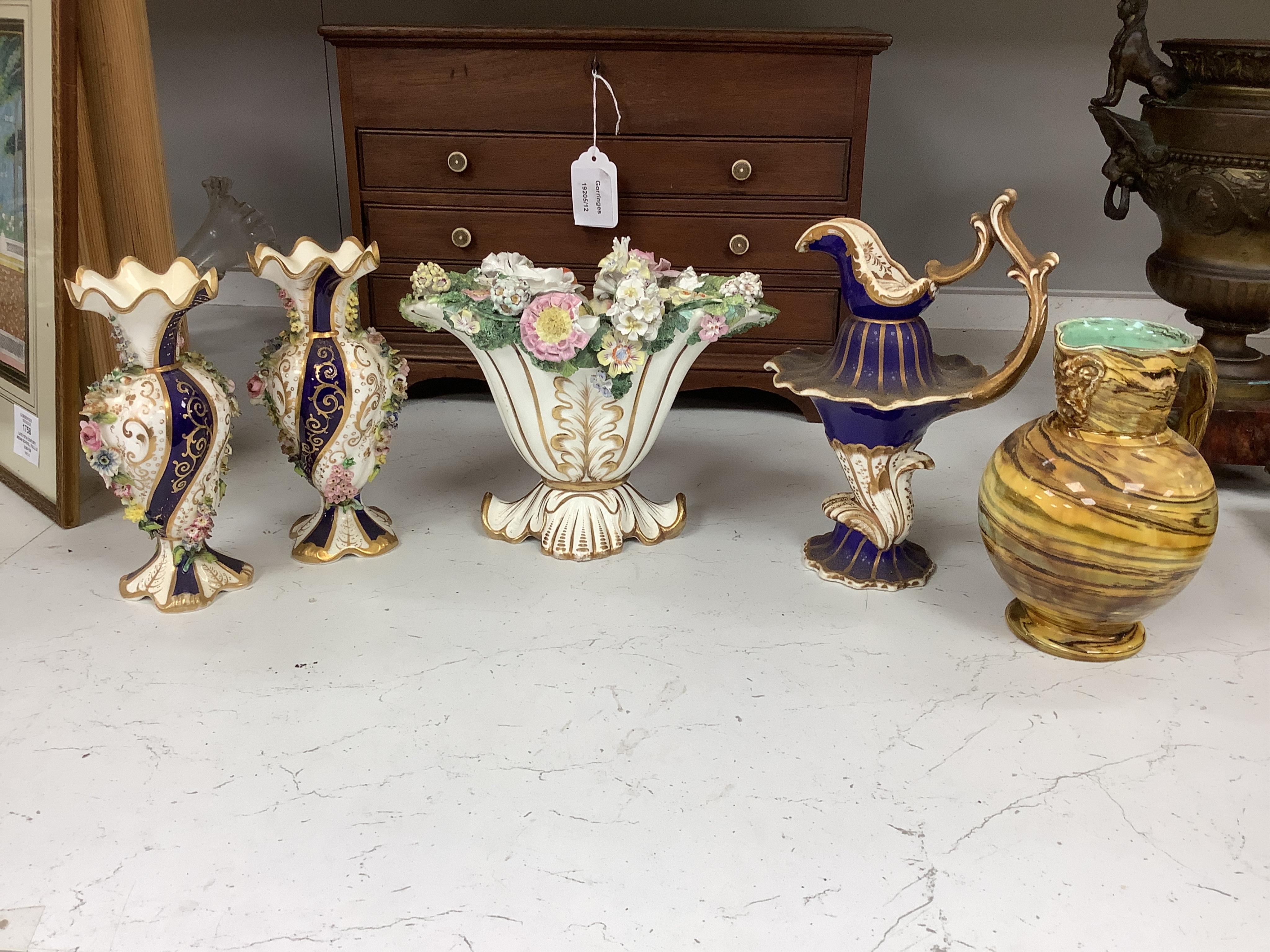 Large group of 19th/20th century English ceramics, to include a Rockingham basket, other English porcelain flower encrusted vessels, a Copeland and Garrett ewer, a Minton Sevres style beaker, a Wedgwood agate ware jug, R